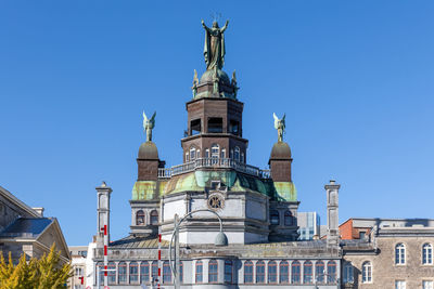 Low angle view of cathedral against clear blue sky