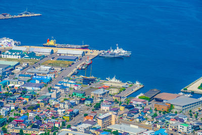 High angle view of townscape by sea