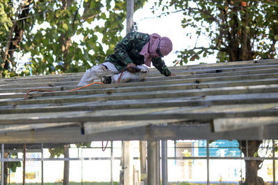 Welding the roof truss.welders working at dangerous heights. welding of steel is very technically 