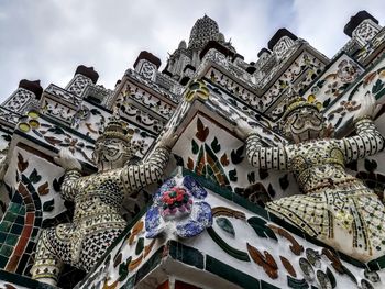 Low angle view of ornate building against sky