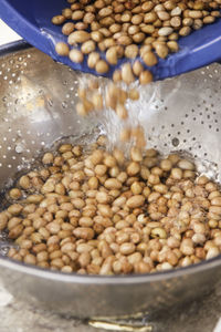 Peanuts being poured in colander