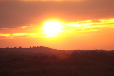 Silhouette of landscape against sky during sunset