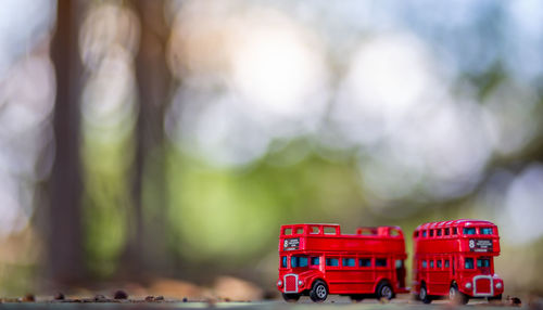 Close-up of red toy car on table