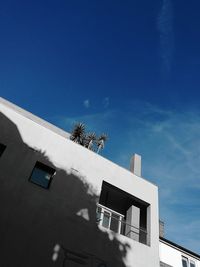 Low angle view of building against blue sky