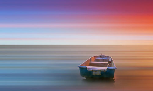 Close-up of boat in sea against clear sky