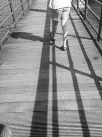 Low section of woman standing on tiled floor