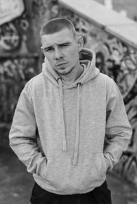 Portrait of young man standing outdoors