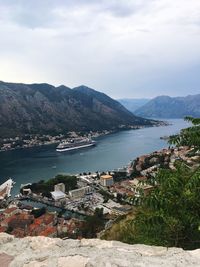 Scenic view of sea by city against sky