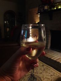 Close-up of hand holding wine glass