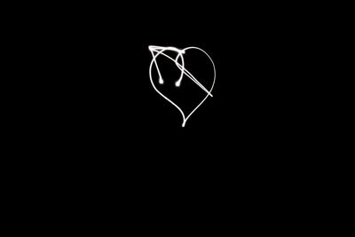 Close-up of heart shape over black background