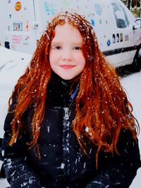 Portrait of a smiling young woman in winter