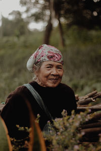 Portrait of old woman wearing hat