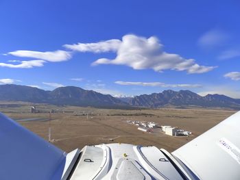 Scenic view of mountains against blue sky