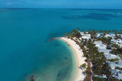 High angle view of bay against clear blue sky