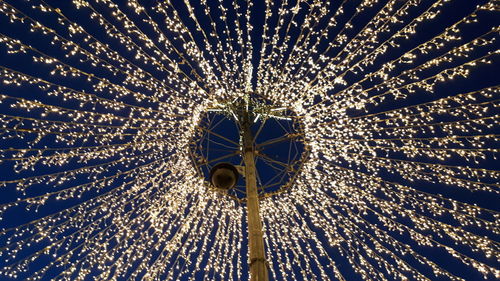 Low angle view of illuminated chandelier