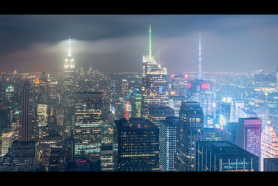 Illuminated buildings in city at night