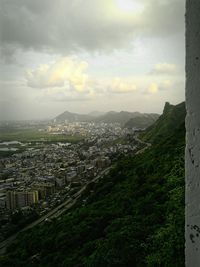 Cityscape against cloudy sky