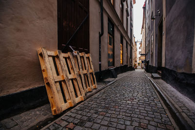 Narrow alley amidst buildings in city