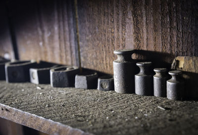 Close-up of weights on shelf