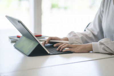 Man using laptop on table