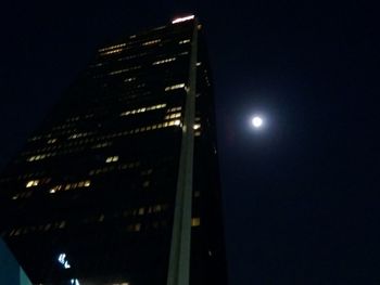 Low angle view of illuminated street light at night