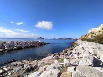 Scenic view of sea against blue sky