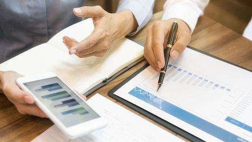 High angle view of business people working on table