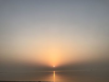 Scenic view of sea against clear sky during sunset