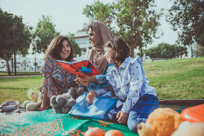 Woman sitting in park