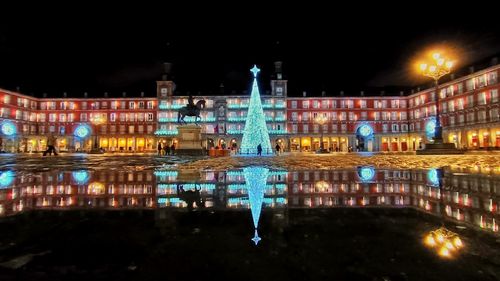 Illuminated buildings in city at night