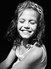 Close-up portrait of a smiling young woman