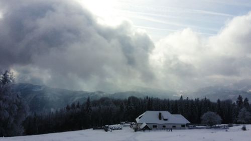 Scenic view of mountains against sky during winter