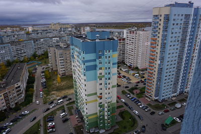 Metropolis. large apartment buildings in the city by the river.