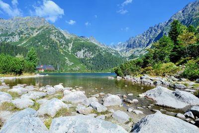 Scenic view of lake and mountains against sky