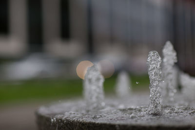 Circular stone water fountain flowing