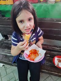Portrait of woman eating food
