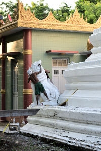 Statue against building