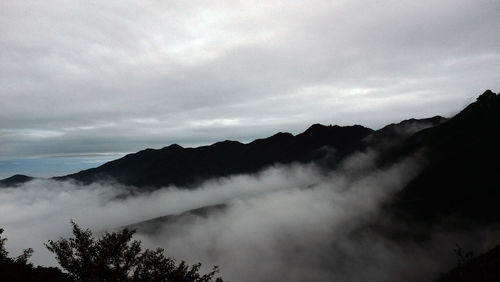 Scenic view of silhouette mountains against sky