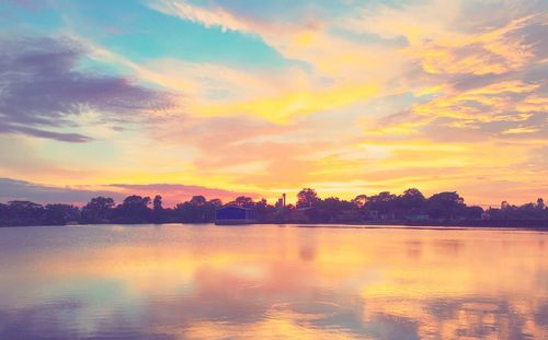 Scenic view of calm lake at sunset