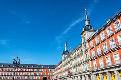 Low angle view of plaza mayor against clear blue sky