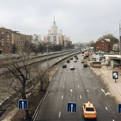 High angle view of cars on city against sky