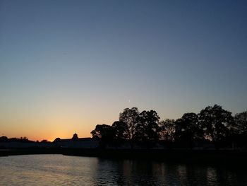 Scenic view of calm sea at sunset