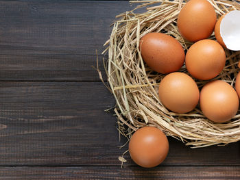 High angle view of eggs in basket on table