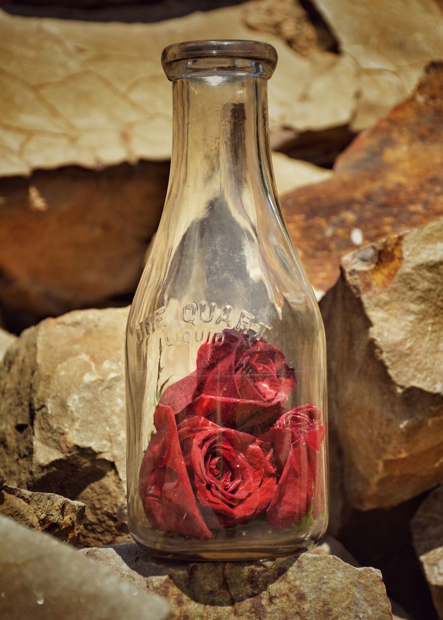 close-up, still life, indoors, food and drink, red, focus on foreground, table, freshness, selective focus, no people, jar, food, single object, day, glass - material, container, high angle view, wood - material, healthy eating, bottle