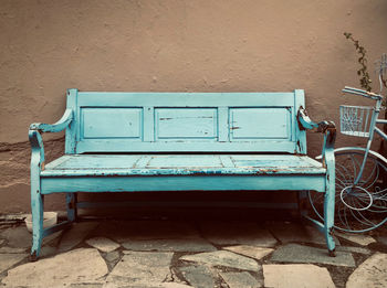 Empty chair against wall