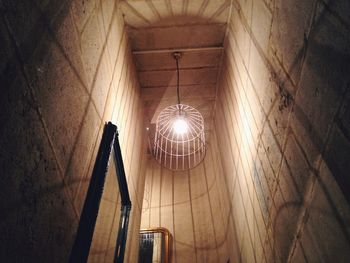 Low angle view of illuminated underground walkway