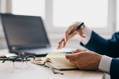 Man using laptop on table