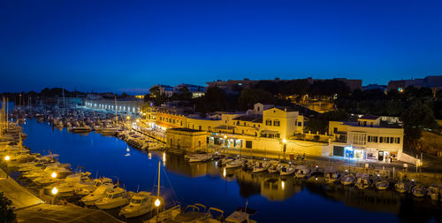 Reflection of illuminated buildings in water at night