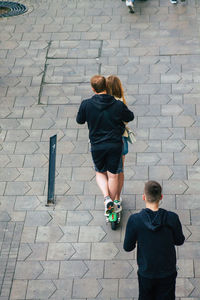 Rear view of friends on street