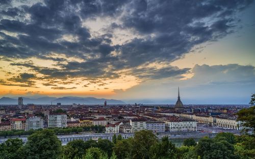 Panoramic view of buildings against sky during sunset